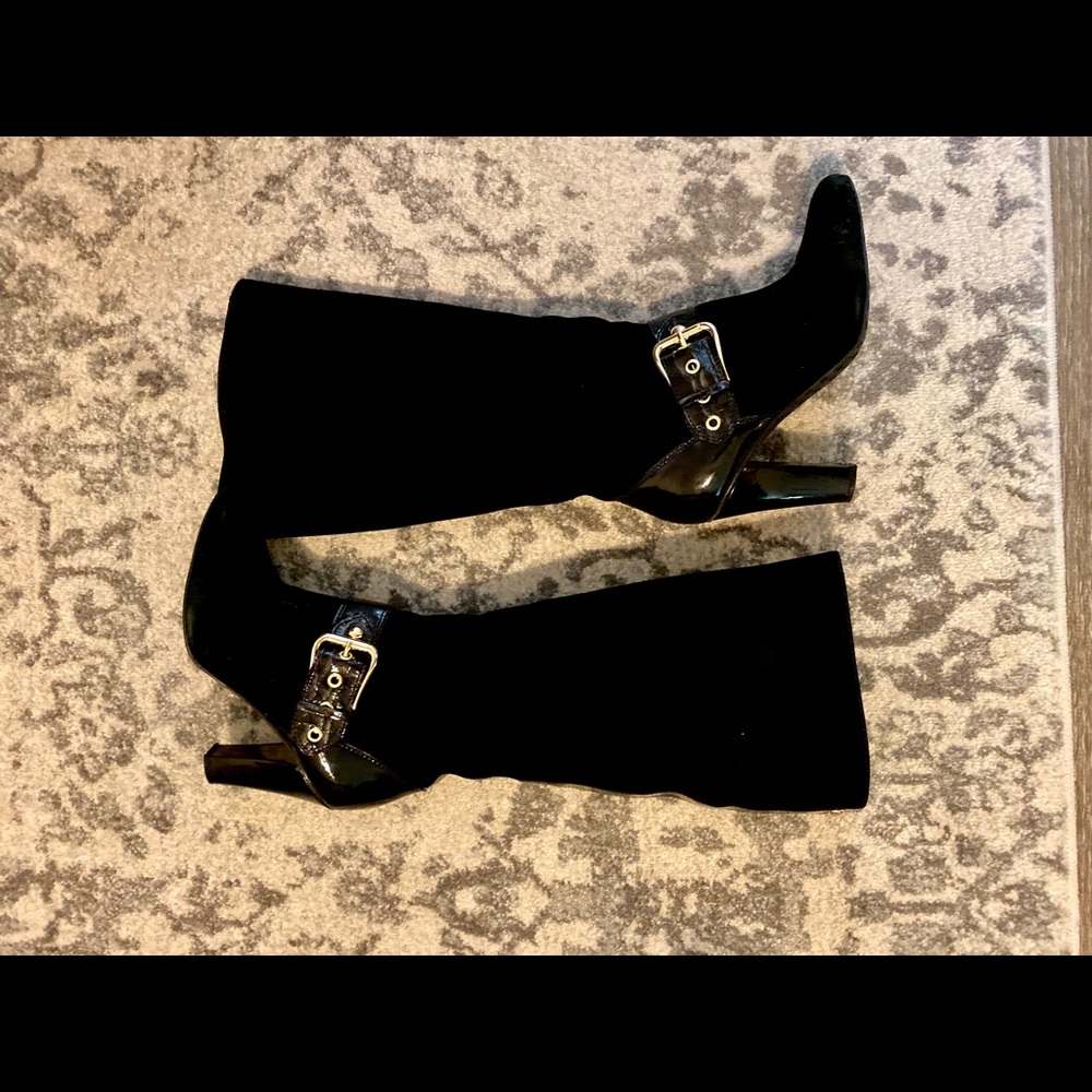 Black knee high boots with gold detail